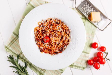 Italian Spaghetti Cherry Tomato Grated Cheese Topの写真素材