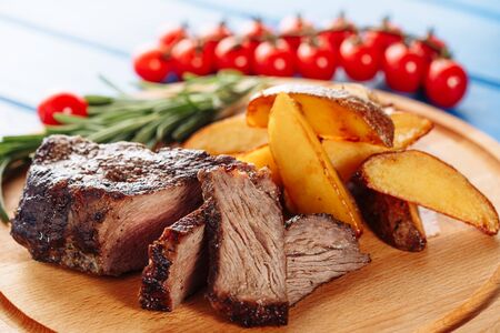 Steak Beef Meat Fried Cooked Sliced Potato Sideの写真素材
