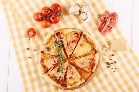 Pepperoni Pizza with Ham Tomato Cheese Flat Layの写真素材