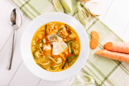Fish Seafood Yellow Soup with Vegetable Flat Layの写真素材