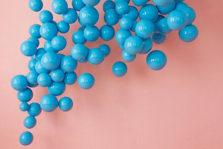 blue balloons, blue bubbles on pink background. Modern punchy pastel colors. Fairy tale cpnceptの写真素材