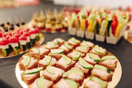 Tiny catering snacks on table. Horizontal photo.の写真素材