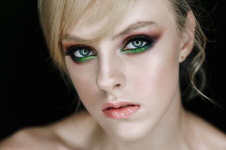 Serious Face Model with Face Make-up Closeup Photoの写真素材