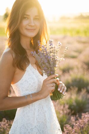 Beautiful Young Woman on Lavender Field Backgroundの写真素材