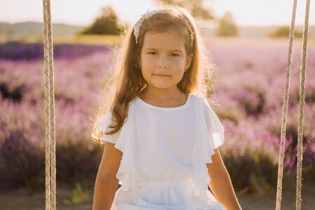 Little Girl Portrait on Lavander Field Backgroundの写真素材
