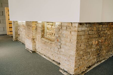Old Brick And Modern White Wall Interior Design Copyspace. Home Or Office Minimal Decorated Room. Inside Grey Carpet Floor and Building Vintage Material. Apartment or Business Spaceの写真素材