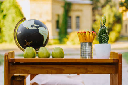 School Globe Composition On Wooden Table Outsideの写真素材