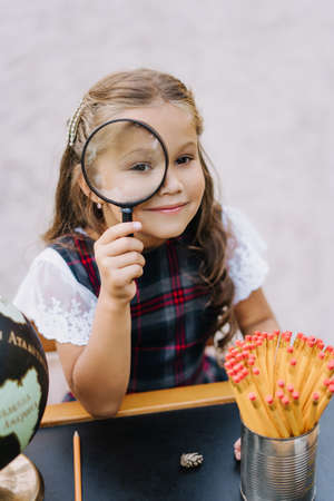 Pretty Primary Schoolgirl Look Through Magnifierの写真素材