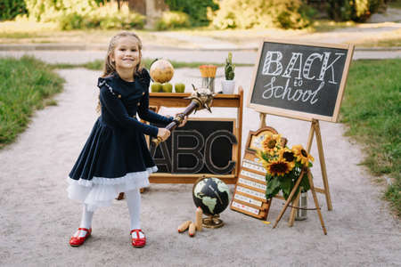 Joyful Schoolgirl Hold Wooden Mace School Supply