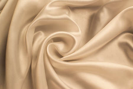 delicate texture of cream-colored silk fabricの写真素材
