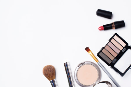 Powder, eye shadow, mascara, brushes are on a white background. Cosmetics for women on a white background and a place for textの写真素材