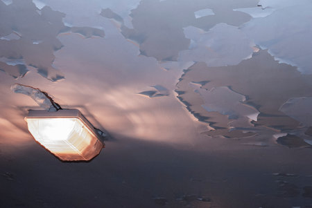 the peeling paint on the ceiling with a lampの写真素材