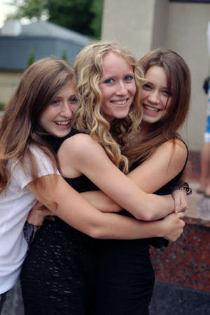 Three beautiful Ukrainian girlfriends, sisters, women, girls of Slavic European appearance pose in the camera on the International Day of Friendship and Friendsのeditorial素材