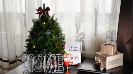 New Years holiday, Christmas canoon at home with a Christmas tree, candles, postcards, handouts, gifts, present, boxesの写真素材
