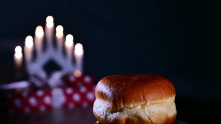A sweet donut sprinkled with powder sugar for the Jewish holiday of Hanukkah at home. Close upの写真素材