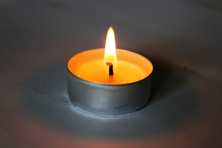 Candle light in the dark roomの写真素材