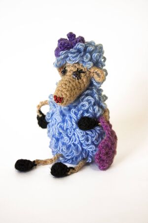 Handmade knitted toy (glamorous blue sheep) isolated on white backgroundの写真素材
