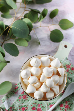 small meringues in a ceramic vase, shot with natural lightの写真素材