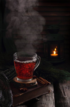 cup of hot boiling black tea in winter scenery, natural smokeの写真素材