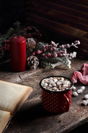 hot coffee with marshmallow and chocolate on a wooden table, in Christmas decorationsの写真素材