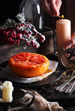 Baked grapefruit with butter and brown sugar, in Christmas decorationsの写真素材