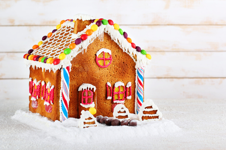 multi-colored gingerbread house on a white backgroundの写真素材