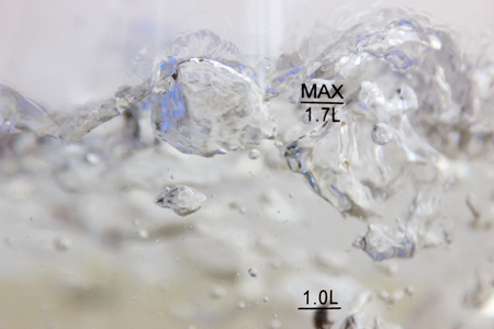 Studio photography of bubbles boiling water in an electric kettleの写真素材