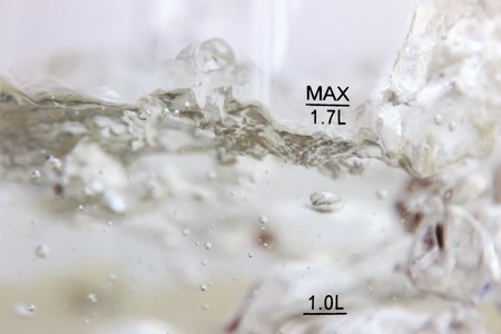Studio photography of bubbles boiling water in an electric kettleの写真素材