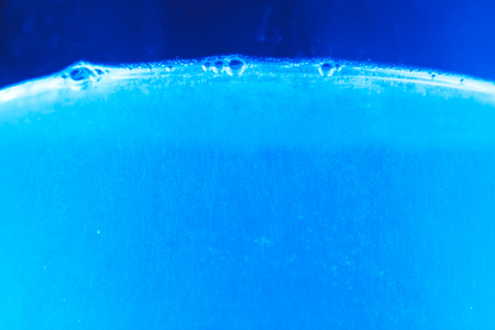 Studio photography of bubbles boiling water in an electric kettleの写真素材