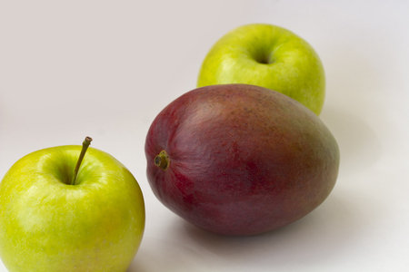 Apple and mango on white background mango, isolated, freshの写真素材