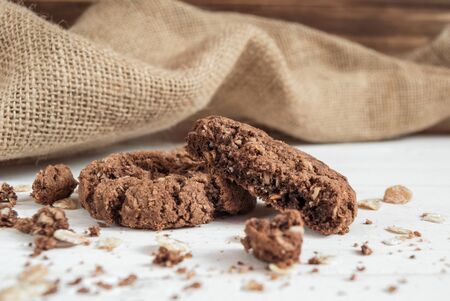 broken chocolate chip cookie on the tableの写真素材