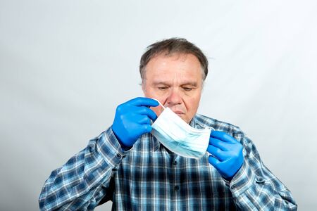 Man puts a face shield against a virus during a pandemic