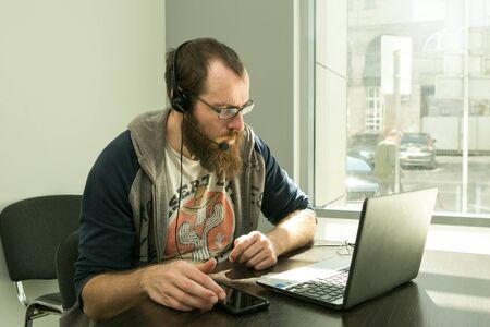 Online lesson. A young man conducts an online lesson during quarantine. Pandemic.
