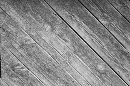 Old wooden boards are tilted, a fragment of the surface for the background. Vintage wallpaper.の写真素材