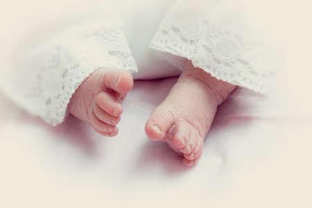 Children Babies. Child care. Small legs of a newborn baby.