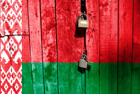 Flag of Belarus is on texture. Template. Coronavirus pandemic. Countries are closed. Locks.の写真素材