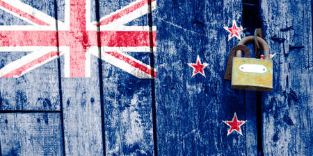 New zealand flag is on texture. Template. Coronavirus pandemic. Countries are closed. Locks.の写真素材