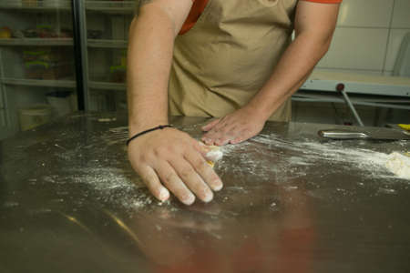 Healthy food concept. The process of making natural egg noodles. The hands of the chef prepare the...