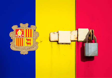 Andorra flag is on texture. Template. Coronavirus pandemic. Countries may be closed. Locks.の写真素材