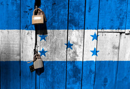 Honduras flag is on texture. Template. Coronavirus pandemic. Countries may be closed. Locks.の写真素材