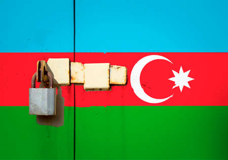 Azerbaijan flag is on texture. Template. Coronavirus pandemic. Countries may be closed. Locks.の写真素材