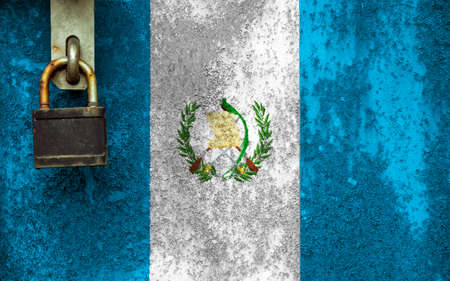 Guatemala flag is on texture. Template. Coronavirus pandemic. Countries may be closed. Locks.の写真素材