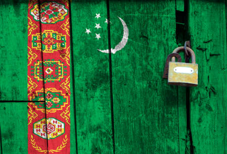 Flag of Turkmenistan is on texture. Template. Coronavirus pandemic. Countries may be closed. Locks.の写真素材