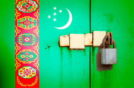 Flag of Turkmenistan is on texture. Template. Coronavirus pandemic. Countries may be closed. Locks.の写真素材