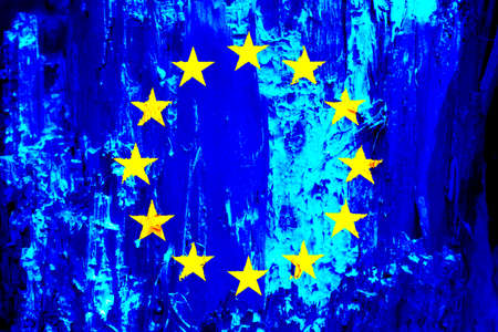 EU flag on texture background. Background for greeting cards for EU public holidays. Europe Day is celebrated on May 9. Day of the Schumann Declaration is celebrated on May 5.の写真素材