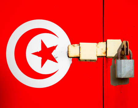 Tunisia flag is on texture. Template. Coronavirus pandemic. Countries may be closed. Locks.の写真素材