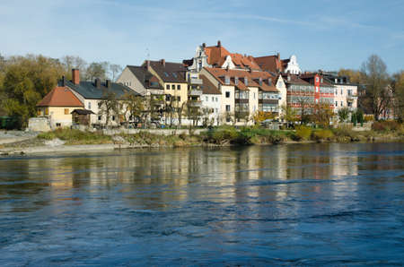 Danube River. Houses on Naberzhnaya. The stone bridge is the main attraction of Regensburg.の写真素材