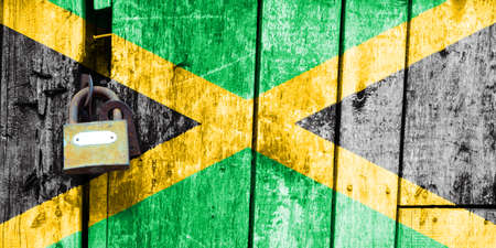 Jamaica flag is on texture. Template. Coronavirus pandemic. Countries may be closed. Locks.の写真素材