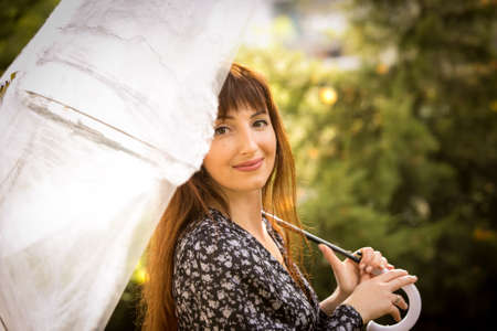 Halloween. Beautiful young woman in a festive mood at a Halloween picnic. Warm autumn October day. Emotion concept.の写真素材