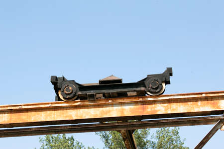 Building. Close-up of a construction crane against the blue sky.の写真素材